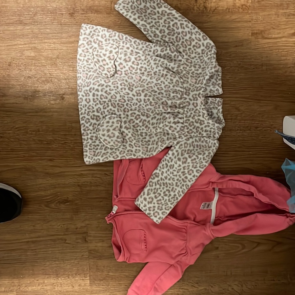 One Carter cheetah fleece and one Carter’s pink sweatshirt. 18 months old.